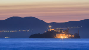 A view of Alcatraz at sunset from Pier 39 with the Marin Headlands behind