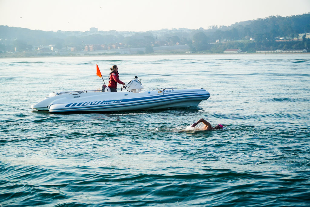 San Francisco open water swimmer guided by a Pacific Open Water Swim Co. escort vessel piloted by USCG Licensed Captain.