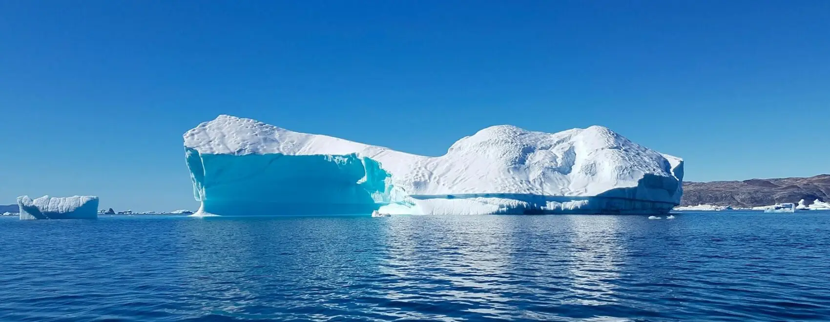 iceberg in body of water